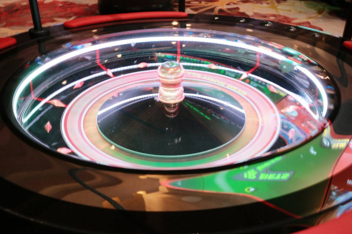 Electronic roulette wheel under glass with lights